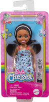 Barbie Chelsea Doll, Small Doll Wearing Removable Blue Dress with Colorful Print & Pink Shoes, Brown Hair & Green Eyes